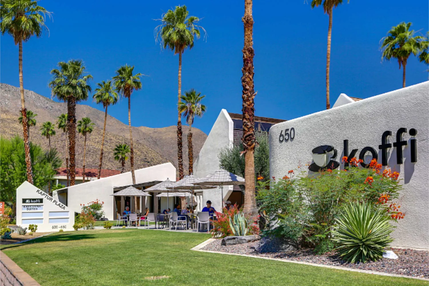 Koffi coffee shop in Palm Springs with outdoor seating and palm trees
