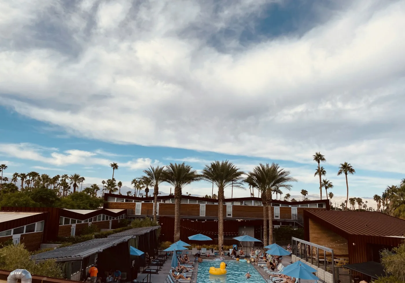 Palm Springs pool on a summer day with clear water and desert landscaping