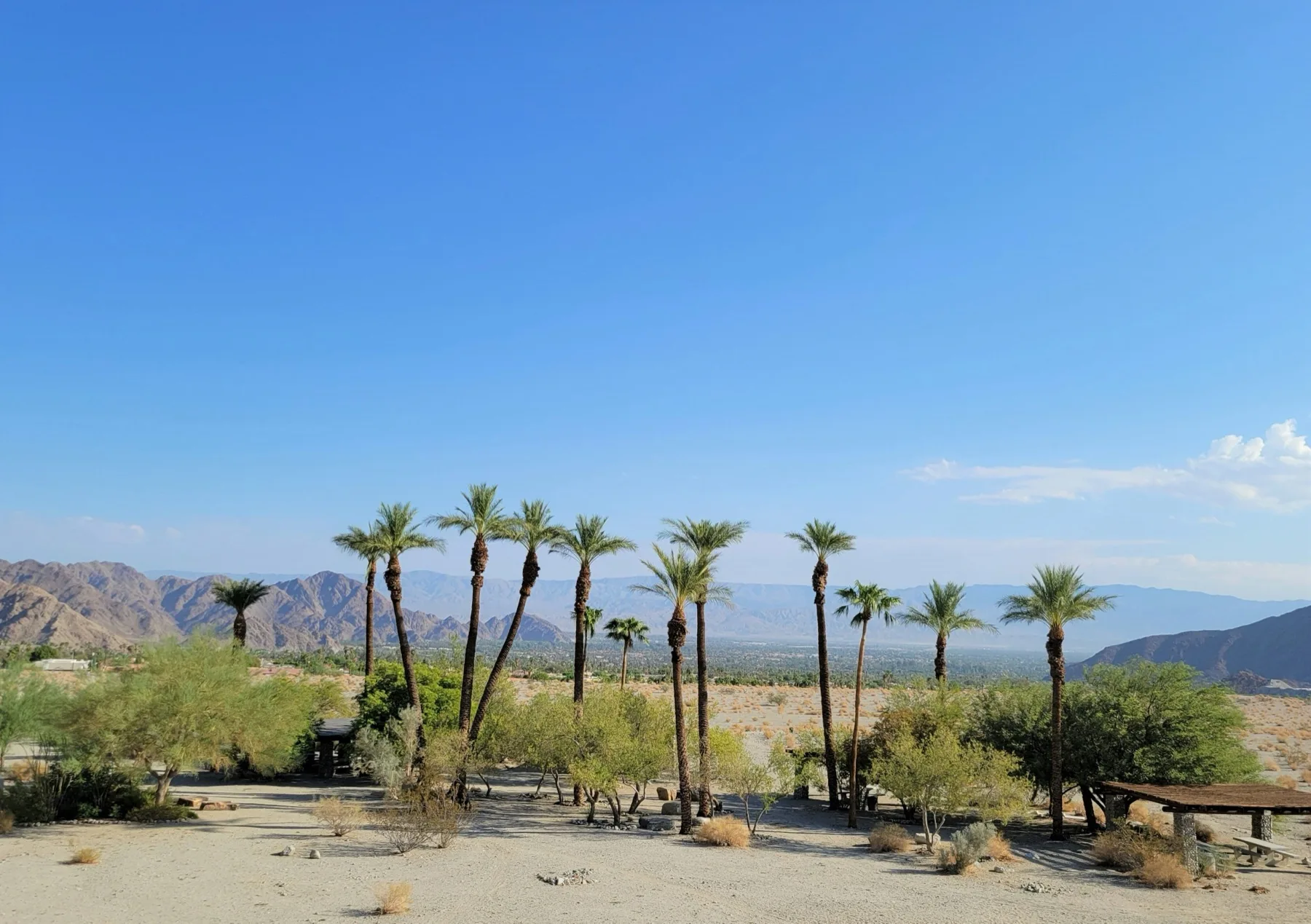 Wide view across the Coachella Valley desert floor with mountains on the horizon