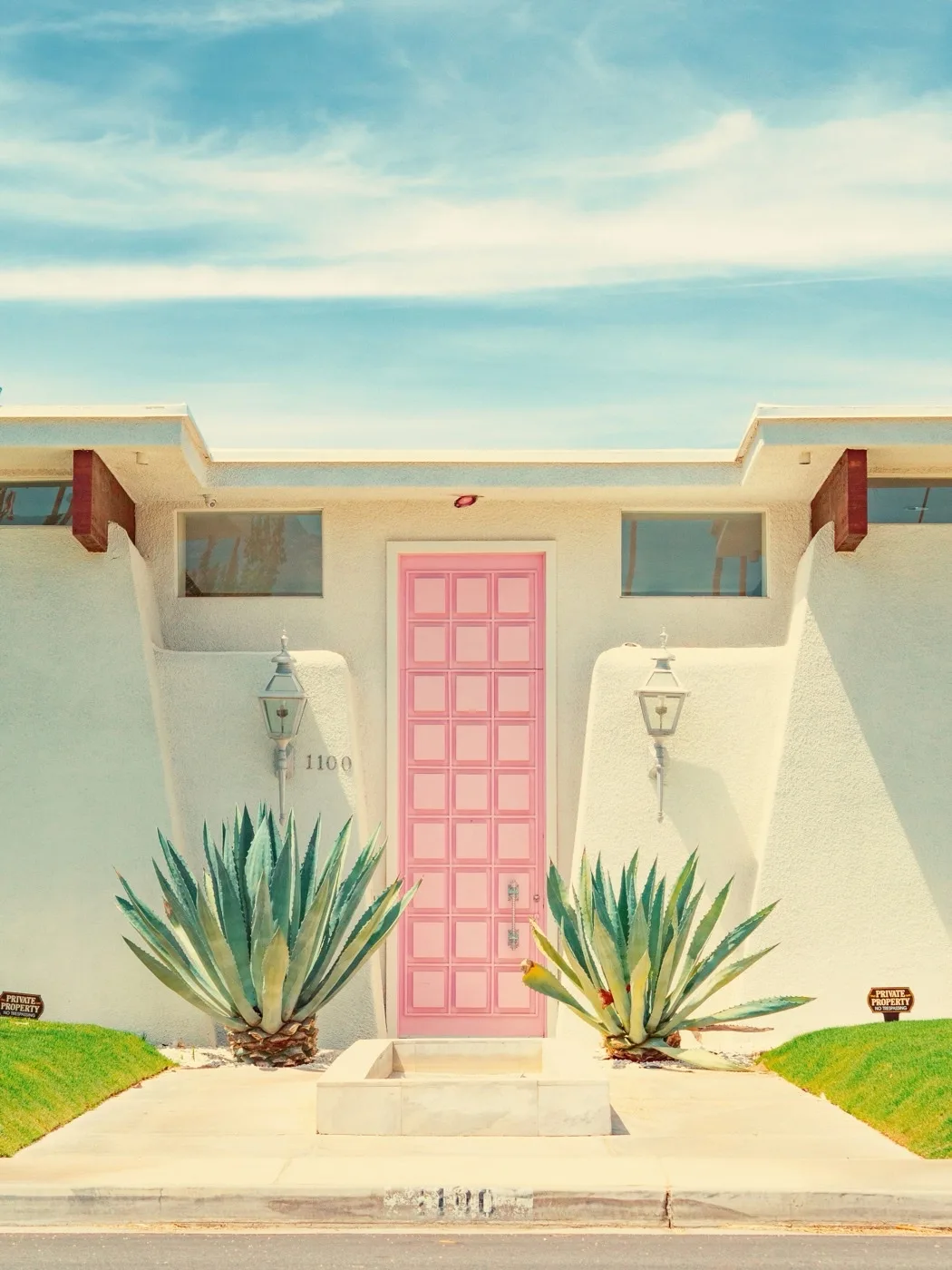Pink midcentury modern front door in Palm Springs residential neighborhood, near Ruth Hardy Park