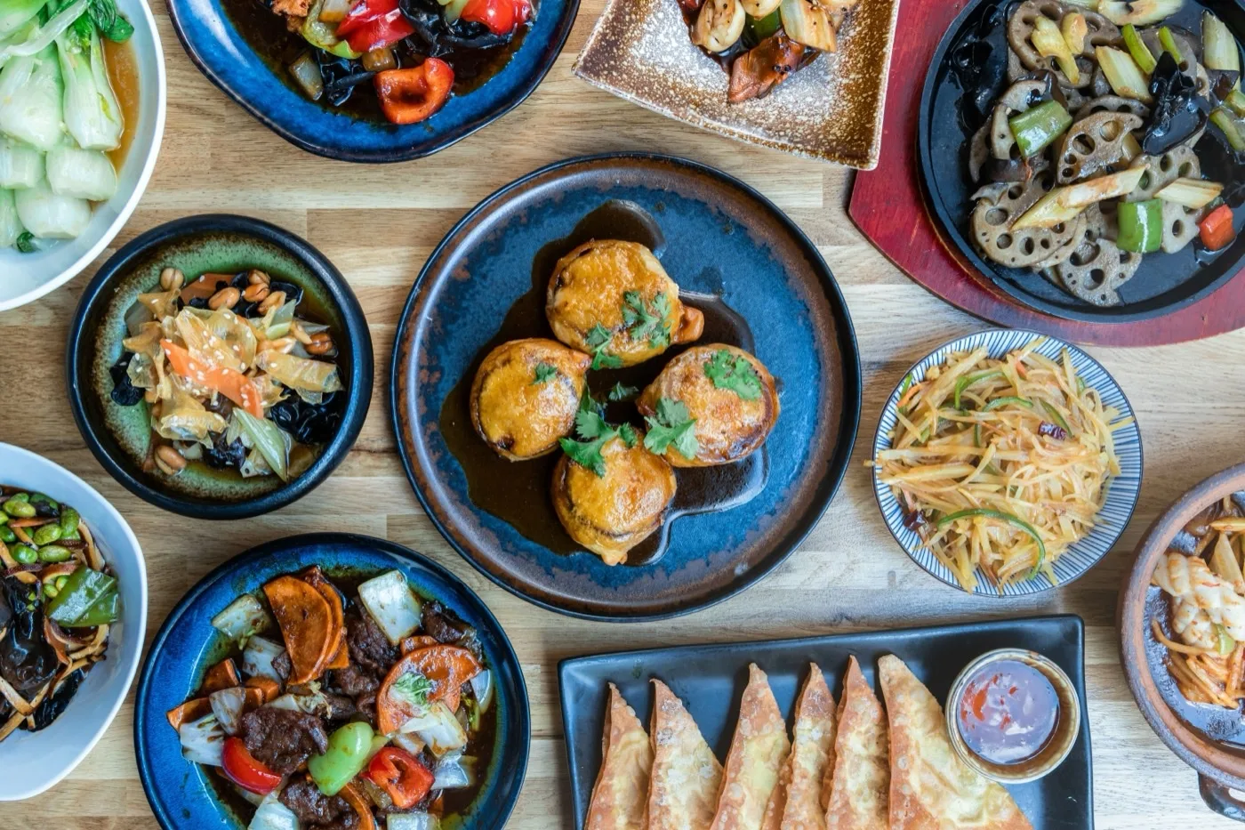 Thai Hot Restaurant plates with stir fry, curry, rice and spring rolls, Indio CA