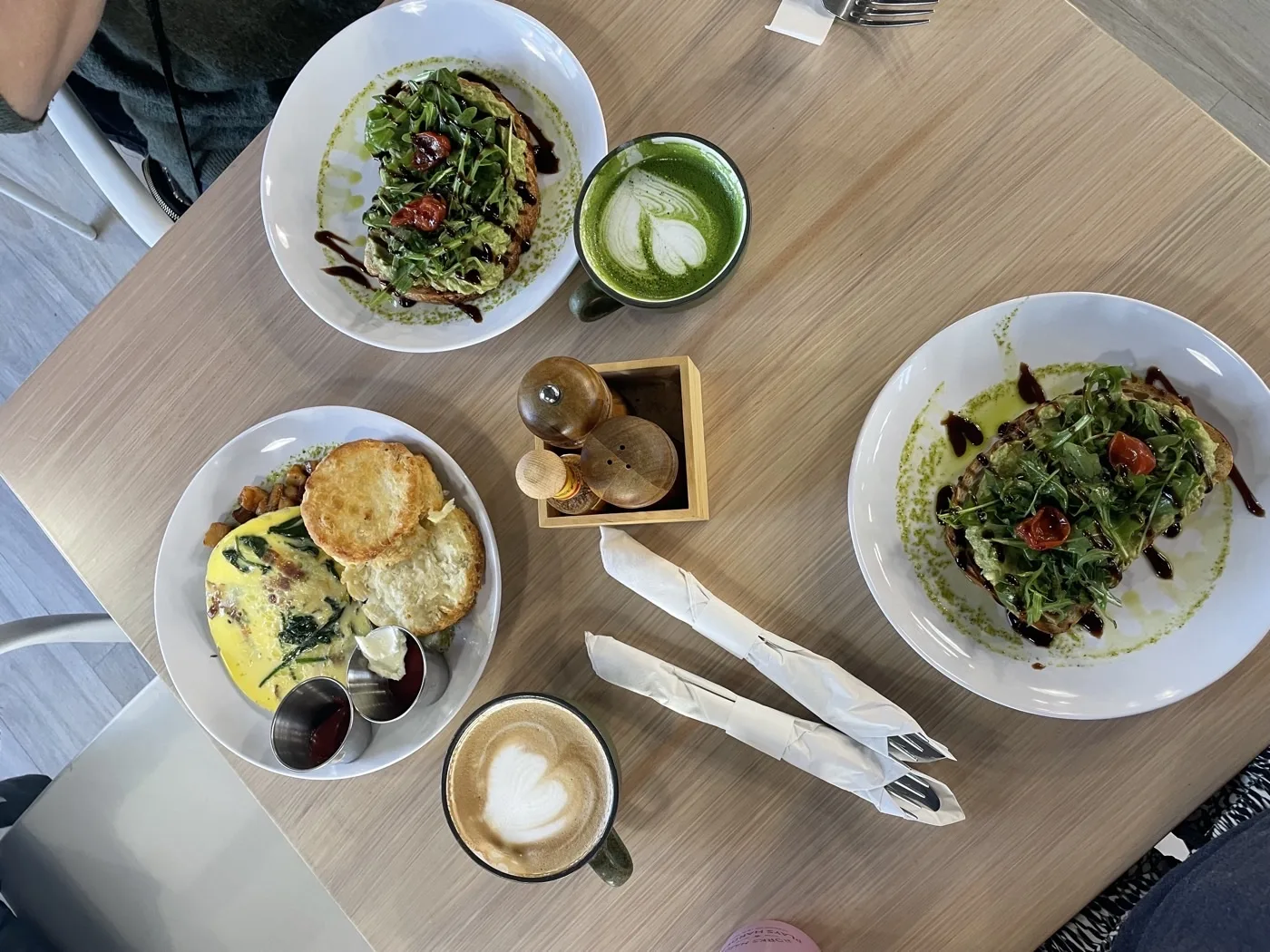 Avocado toast, omelette, matcha latte, and cappuccino at Yes Please café in La Quinta