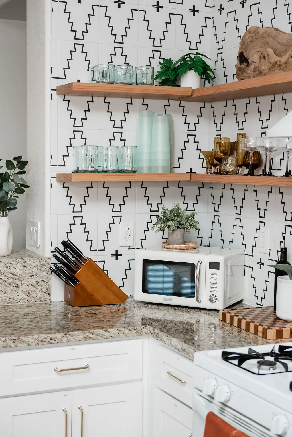 Terra Luz kitchen sage credenza with Cuban and Latin art against Caramel Apple walls