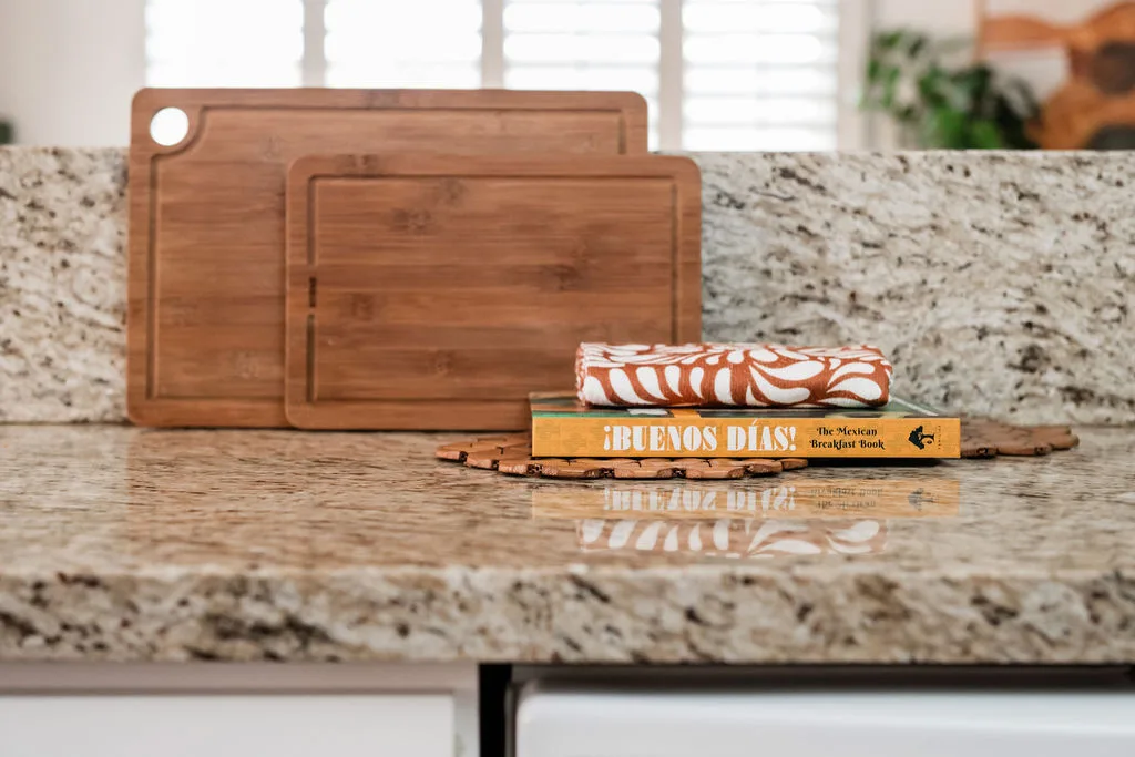 Terra Luz kitchen counter and shelves with morning light and curated objects