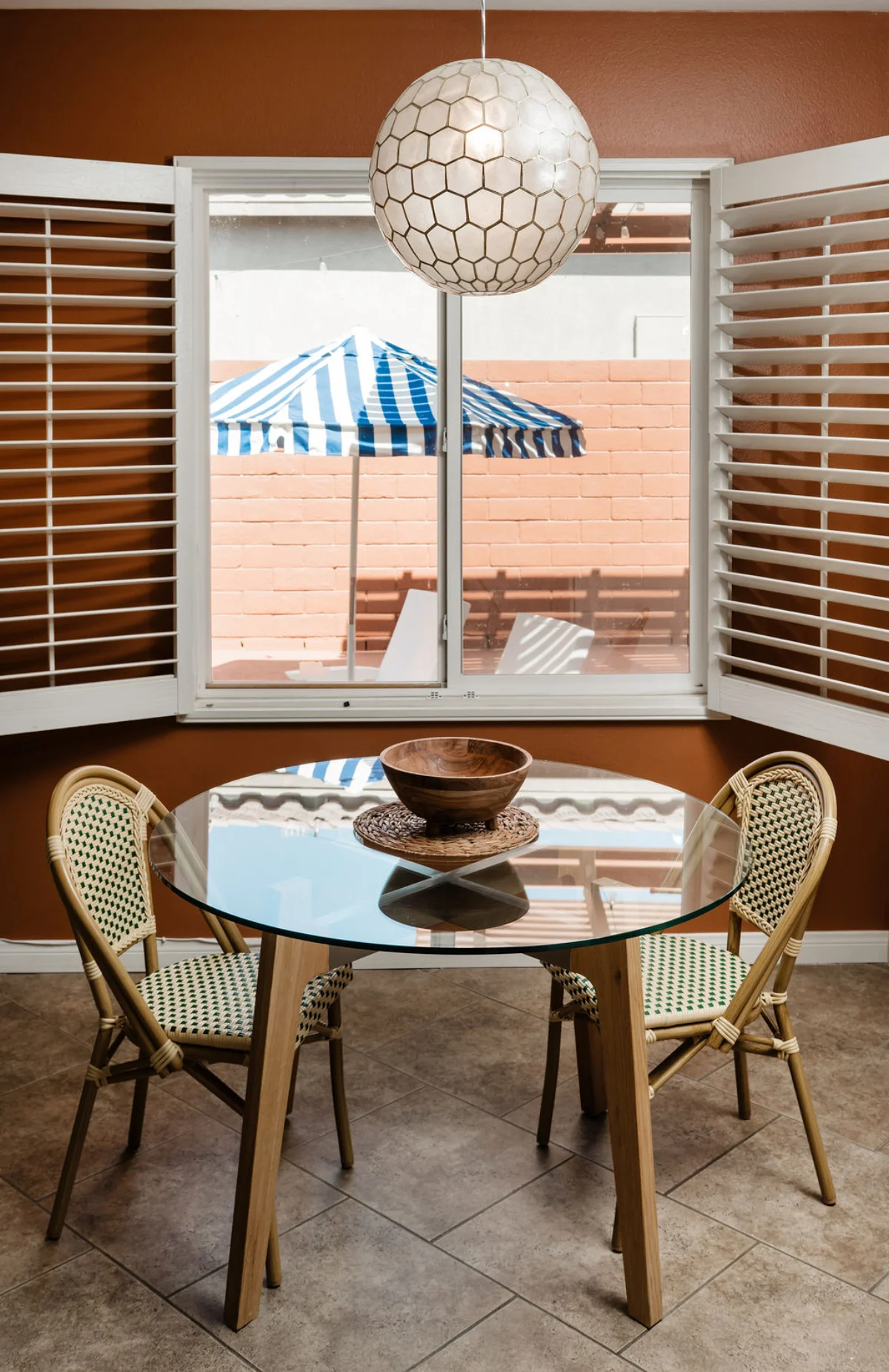 Terra Luz kitchen counter with terracotta tiles, copper accents, and morning light