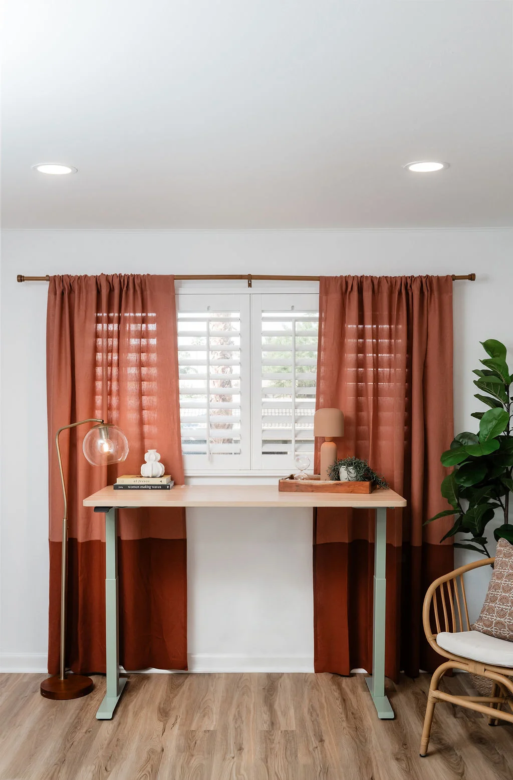 The Sundune Palm Springs second bedroom king bed with striped linen bedding and pink accent wall